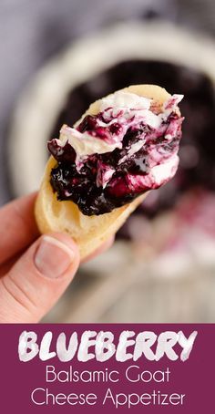 blueberry cheese appetizer is being held up in front of the camera and text reads, blueberry balsamic goat cheese appetizer