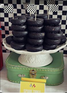 chocolate donuts are stacked on top of each other