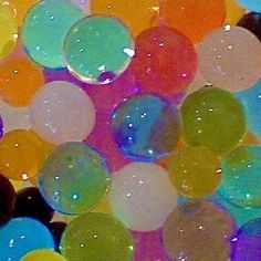 many different colored bubbles floating in the air