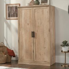 a tall wooden cabinet sitting on top of a hard wood floor next to a clock