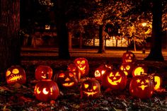 pumpkins carved to look like jack o lantern faces