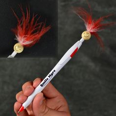 a person holding a white pen with red feathers on it and two photos of the same pen