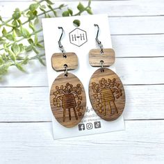 the wooden earrings are designed to look like people