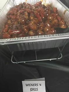 a metal pan filled with food on top of a table