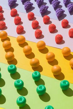 an array of different colors and sizes of buttons on a board game with the number seven