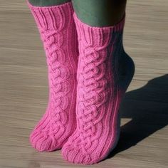 the legs of a woman wearing pink socks