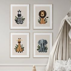 four framed pictures hang on the wall in a child's room