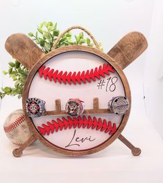 a baseball themed clock with three rings on it