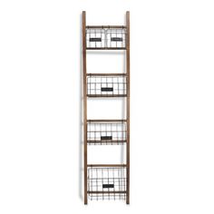 a tall wooden shelf with baskets on it