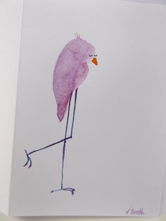 a pink bird is standing on one leg