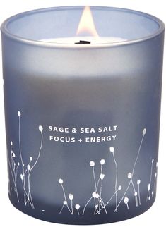 a candle that is sitting in front of a white background with the words sage and sea salt focus + energy on it