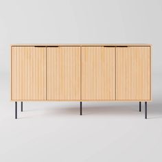 the sideboard is made out of wood and has three doors on one side, two drawers