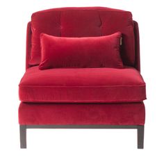 a red velvet chair with two pillows on it's back and the seat upholstered