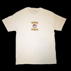 a white t - shirt with the words happy birthday written in yellow and red on it