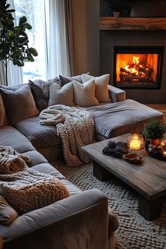 Cozy living room with oversized L-shaped sectional, fireplace, rustic coffee table, and warm lighting Cozy Living Rooms With Sectional, Oversized Sectional, L Shaped Sofa Designs, Oversized Sectional Sofa, Cozy Family Rooms, Relaxing Space, Sectional Sofas Living Room, Cozy Sofa, Cozy Living Spaces