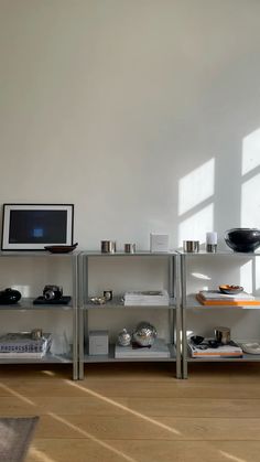 a shelf with various items on it in a room