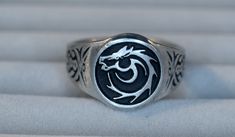 This ring was designed with the Tribal Horse symbol. The horse symbolizes different things to different people.  Most feel the animal represents strength, freedom, intelligence, Power and Wisdom.  The beautiful pewter ring is a silver color and the background is blackened to bring out the fine detail of the design. Our rings are 100% Lead and nickel free pewter and made in the USA The top design part of the ring measures about 15 mm in diameter The ring band tapers from about 15mm to about 4.5mm at the bottom and is about 1.75mm thick We offer free shipping within the USA Rings are available in sizes 7 to 14 Pewter Ring, Horse Ring, Eye Of Horus, Cowboy And Cowgirl, Western Cowboy, One Ring, Rings Statement, Equestrian, Silver Color