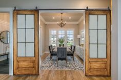 an open door leading to a formal dining room