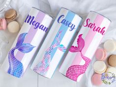 three personalized canisters with mermaid designs and macaroons on the side