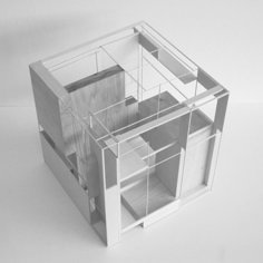 an architectural model of a house on a white surface