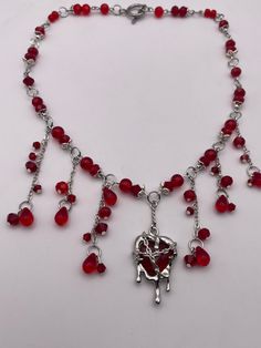 Made with glass beads and soldered heart charm. Red Open Heart Jewelry With Heart Beads, Heart Dripping, Red Metal Heart Necklace, Beaded Blood Drip Necklace, Blood Necklace, Red Gothic Jewelry With Heart Charm, Red Heart-shaped Metal Necklace, Charm Necklaces, Soldering