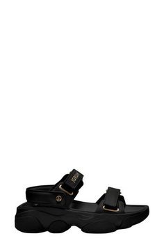 Cushy and versatile, this sandal topped with soft leather features a chunky, sculpted sole and Jordan detailing popping in golden shimmer. 2" heel, 1" platform; 1" slope (size 11) Adjustable hook-and-loop straps Leather upper and lining/rubber sole Imported Nordstrom x Nike: A curated lifestyle destination where fashion is the ultimate sport Givenchy Black Sandals, Nike A, Sandals Outfit, Strap Sandals Women, Fabric Gift Bags, Black Metallic, Metallic Gold, Brown Gold, Strap Sandals