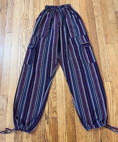 Hardly worn / smoke-free environment / draw string top as well as bottom legs / labeled sz Large measures flat lay elastic waist 9"-14 1/2" comfortably / inseam 27" / length(waist to bottom leg) 38"/ (135) Spring Hippie Loungewear Pants, Hippie Lounge Pants, Hippie Cotton Straight Pants, Hippie Loungewear Trousers, Mexican Pants, Non-stretch Hippie Beach Pants, Hipster Kid, String Top, Hippie Pants