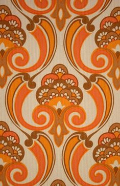 an orange and brown wallpaper pattern with swirls on the back ground, which is very similar to what i have in my house