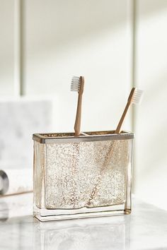 Lend sparkling style to your bathroom with this mercury glass toothbrush holder. | Vizcaya Toothbrush Holder by Anthropologie in Beige Brushed Nickel Bathroom Accessories, Ny Loft, Tooth Brush Holder, Cute Tooth, Vermont Country Store, Bath Collection, Tooth Brush, Candles For Sale, Lotion Dispenser