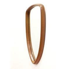 an oval mirror mounted to the side of a wall