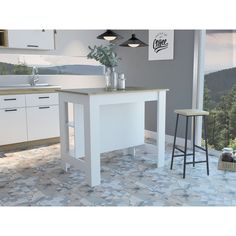 a white kitchen with two stools next to a counter top and an island in the middle