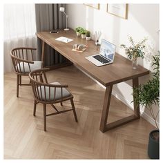 a wooden desk with two chairs and a laptop on it in front of a window