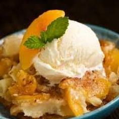 a blue bowl filled with fruit and ice cream