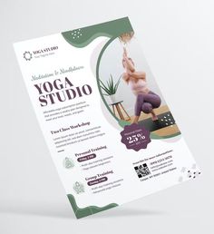 a yoga studio flyer with a woman doing yoga on the mat in front of it