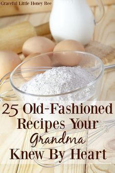 an old fashioned recipe in a glass bowl on a wooden table with eggs and flour