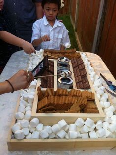 a cake with marshmallows and chocolate on it