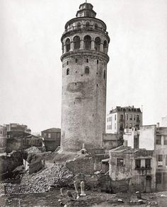 an old black and white photo of a tower