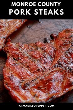 grilled pork steaks on a wooden cutting board with text overlay that reads, how to cook the best beef steak in monroe county porksteaks