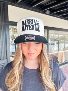 Make a statement with our Marriage Material Trucker Hat. Perfect for the newly engaged or for a playful gift, this hat is made for those who are ready to tie the knot (or just want to pretend until then). With its trendy trucker style, it's the perfect blend of fun and fashion! Novelty Adjustable Trucker Hat With Flat Bill, Adjustable 5-panel Trucker Hat As A Gift, Adjustable Trucker Mini Cap, Adjustable Trucker Hat For Wedding, Novelty Snapback Trucker Hat Adjustable, Novelty Adjustable Snapback Trucker Hat, Adjustable Trucker Style Mini Cap, Novelty Baseball Cap With Flat Bill And Adjustable Fit, Wedding Snapback Trucker Hat