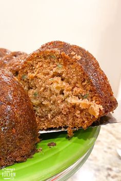 a close up of a bundt cake on a plate with a knife in it