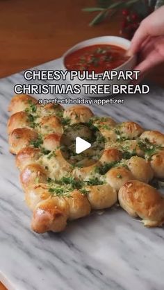 a video showing how to make cheesy pull apart christmas tree bread for the holiday table