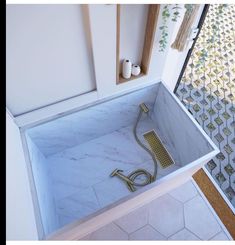 a bathtub with a shower head in it