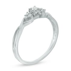 a three stone diamond ring on a white background