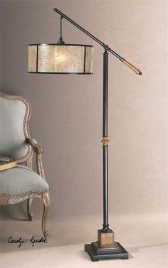 a lamp that is next to a chair