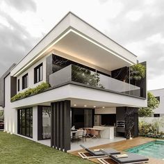 a modern house with a pool in the yard