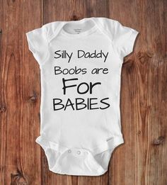 a white baby bodysuit that says i was daddy's fastest swimmer on it