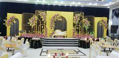 a banquet hall decorated in yellow and black