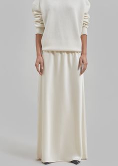 Color: Cream Midweight satiny fabric Slim fit Maxi length A-line silhouette Elasticated waist Slip on style Unlined 100% Polyester Dry Clean By The Frankie Shop. Imported Satin Skirt, Slip On, Satin, Slim Fit, Fabric, Color