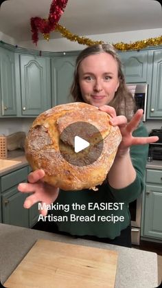 a woman holding a loaf of bread in her hands with the words making the easier artisan bread recipe