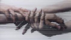 two hands reaching for each other in the middle of a blurry image with white background